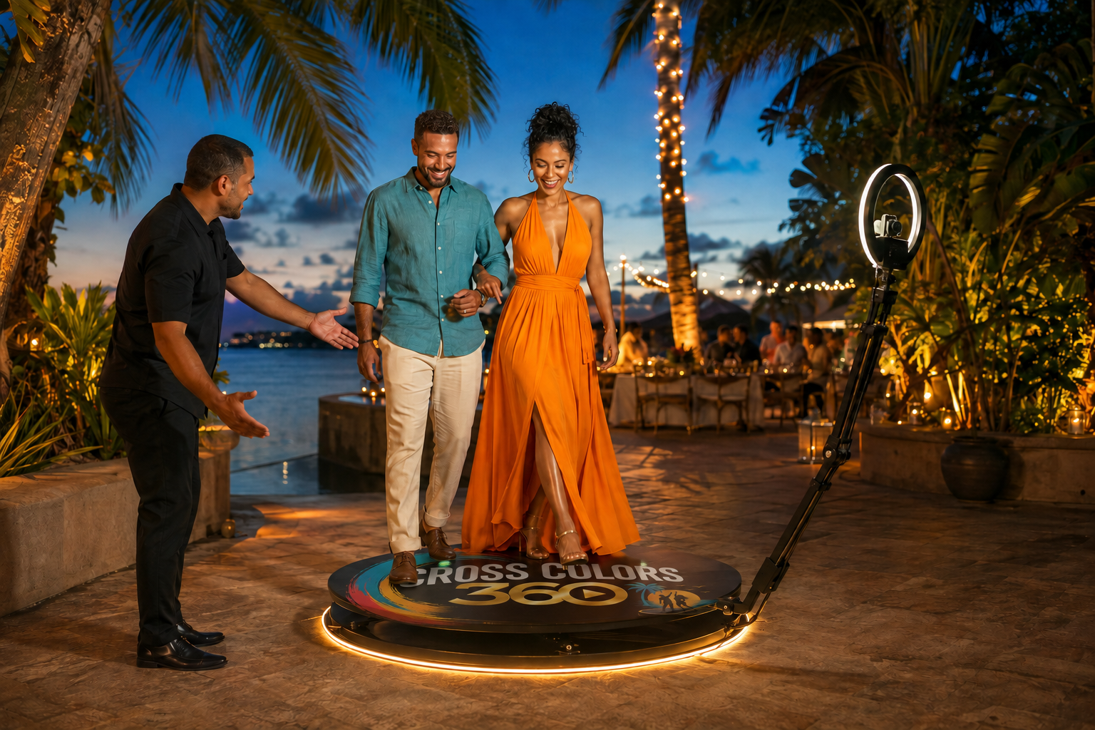 A couple stepping onto the branded Cross Colors 360 booth platform as an attendant welcomes them